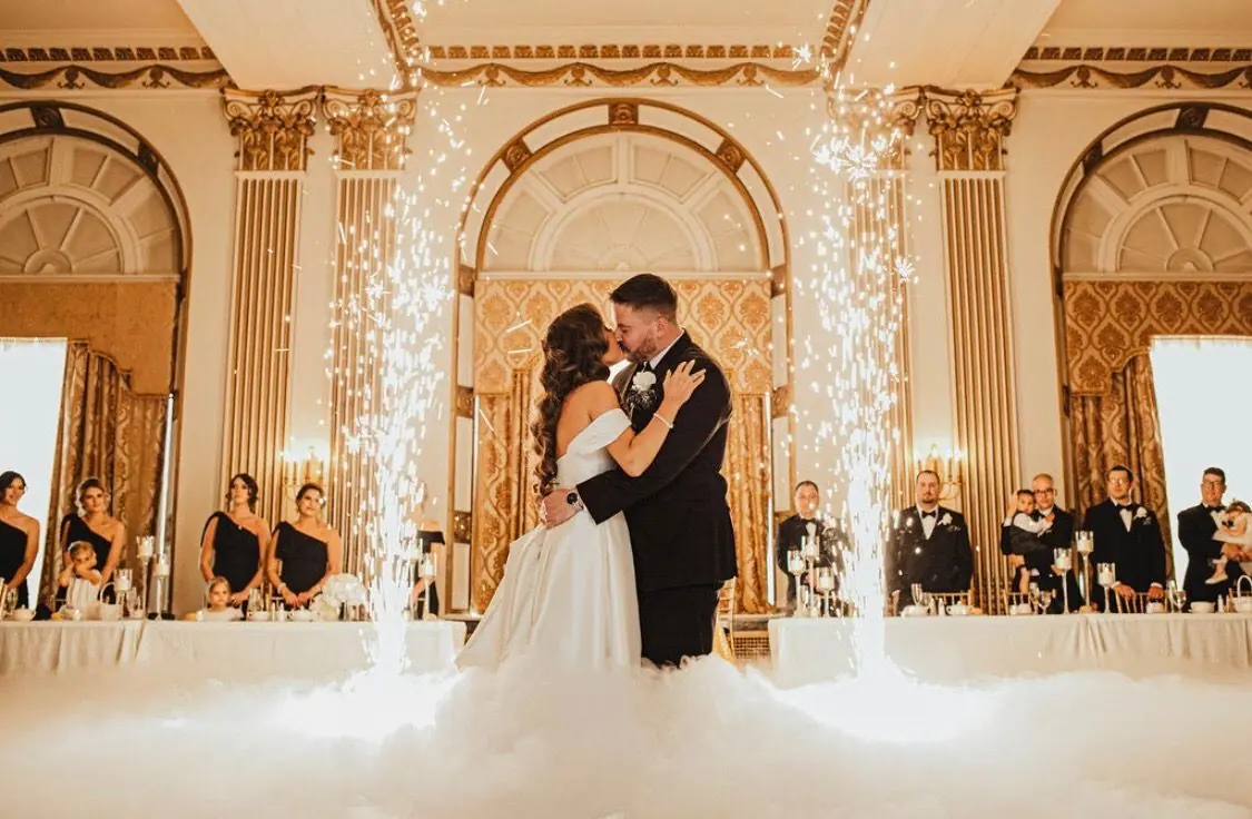 Michael and Shelley’s first dance with cold sparkler fountains in a gold ballroom