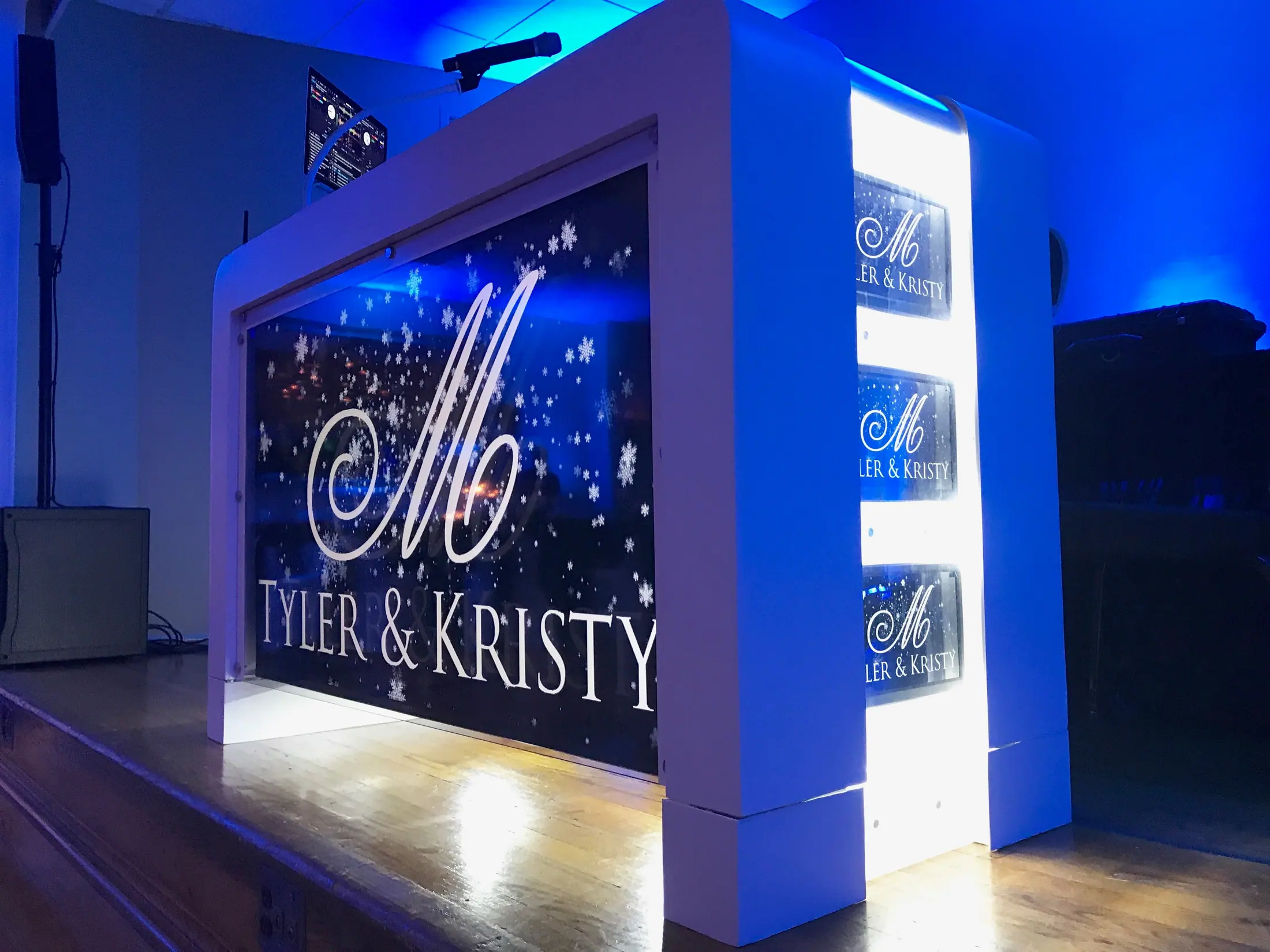 Finest Events video DJ booth displaying a custom wedding monogram on its front screen